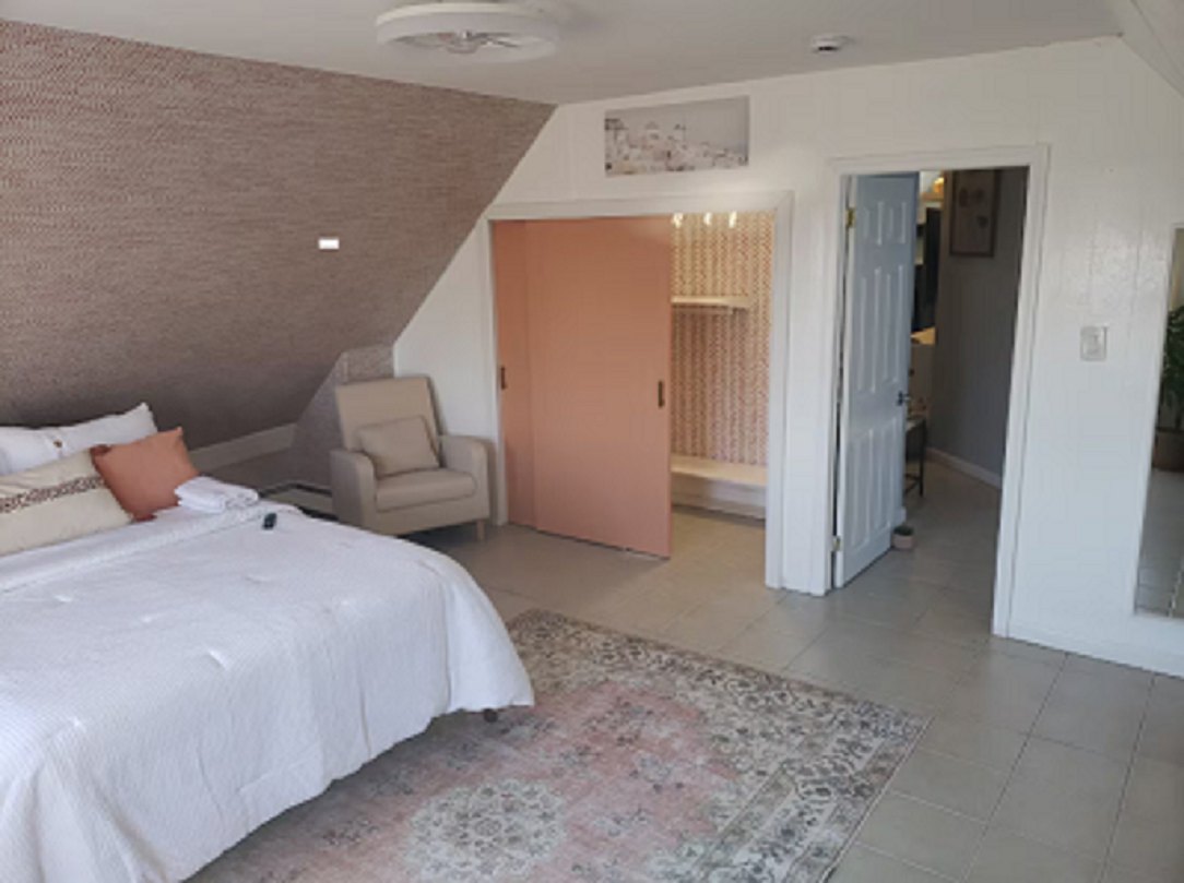 Furnished bedroom with closet